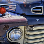 Front of an old beat-up truck | photography, images, and art for hotels, office buildings, homes, restaurants, hospitals, and shopping malls