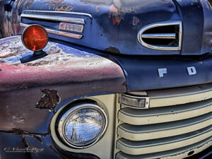 Front of an old beat-up truck | photography, images, and art for hotels, office buildings, homes, restaurants, hospitals, and shopping malls